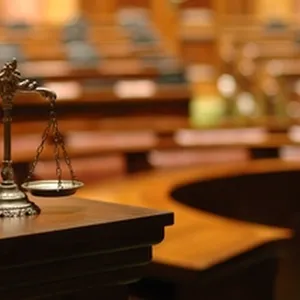 Criminal Aid Dispute Continues